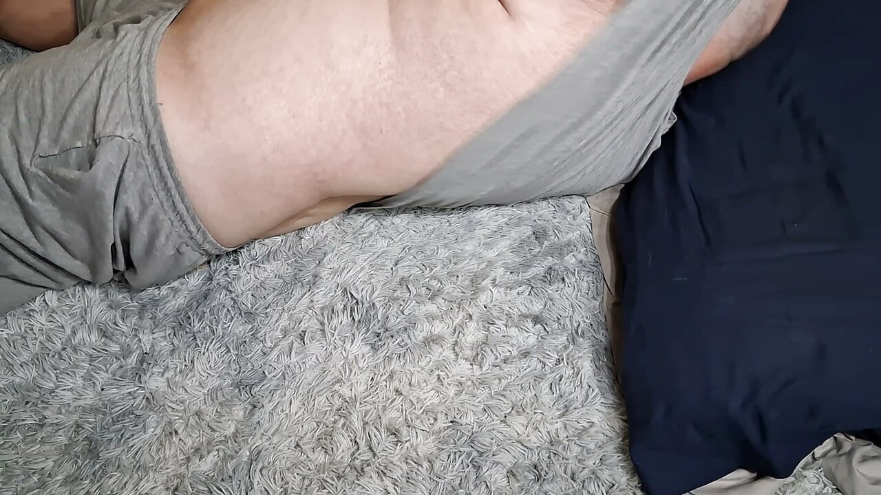 Chubby guy lays on floor and cums