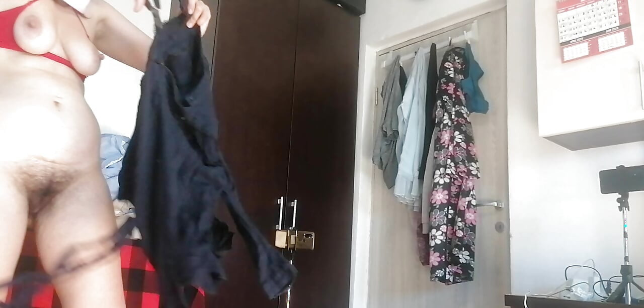 Sexy Latina Having Fun Trying on Clothes and Cutting Them