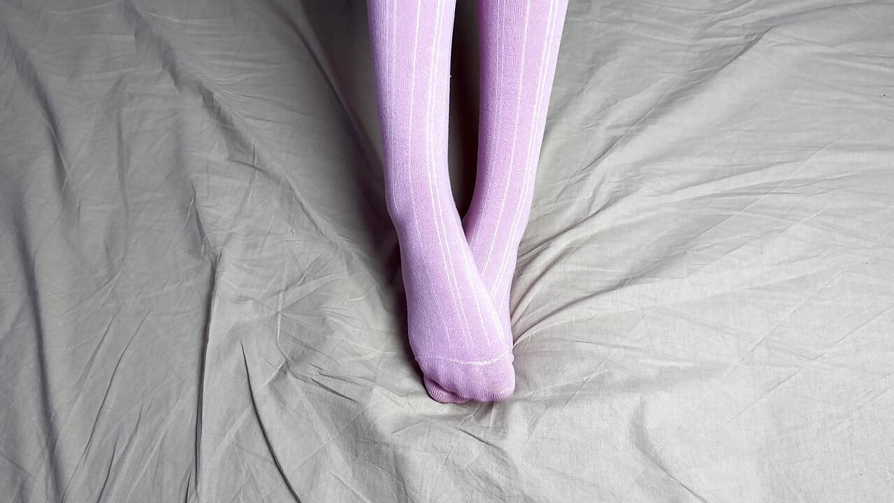 Pink socks in hands of mistress with blue nails in solo video