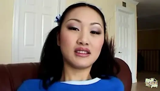 An Asian Female Engages in Self-stimulation While Anticipating Engaging in Intense Anal Intercourse in the Doggie Style Posture.