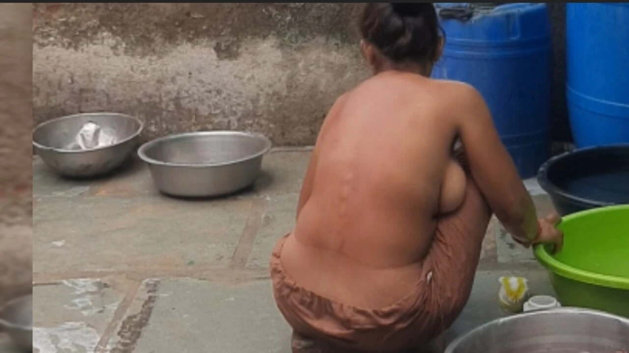 The elder sister-in-law is watching the brother-in-law in the open bathroom after going home naked after walking in the open forest