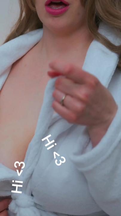 The MILF adjusts her cleavage it s ample and looks beautiful