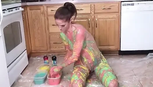 Hot girl puts colors  all on her tits and her pussy in the kitchen