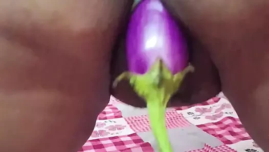 Sexy sister-in-law extinguishing her relaxation fire with brinjal