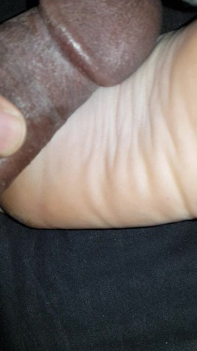 Rubbing cock on wrinkled soles