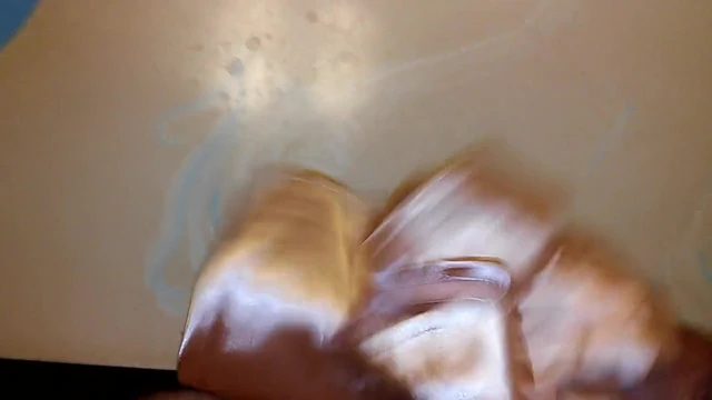 Another cumshot on satin skirt