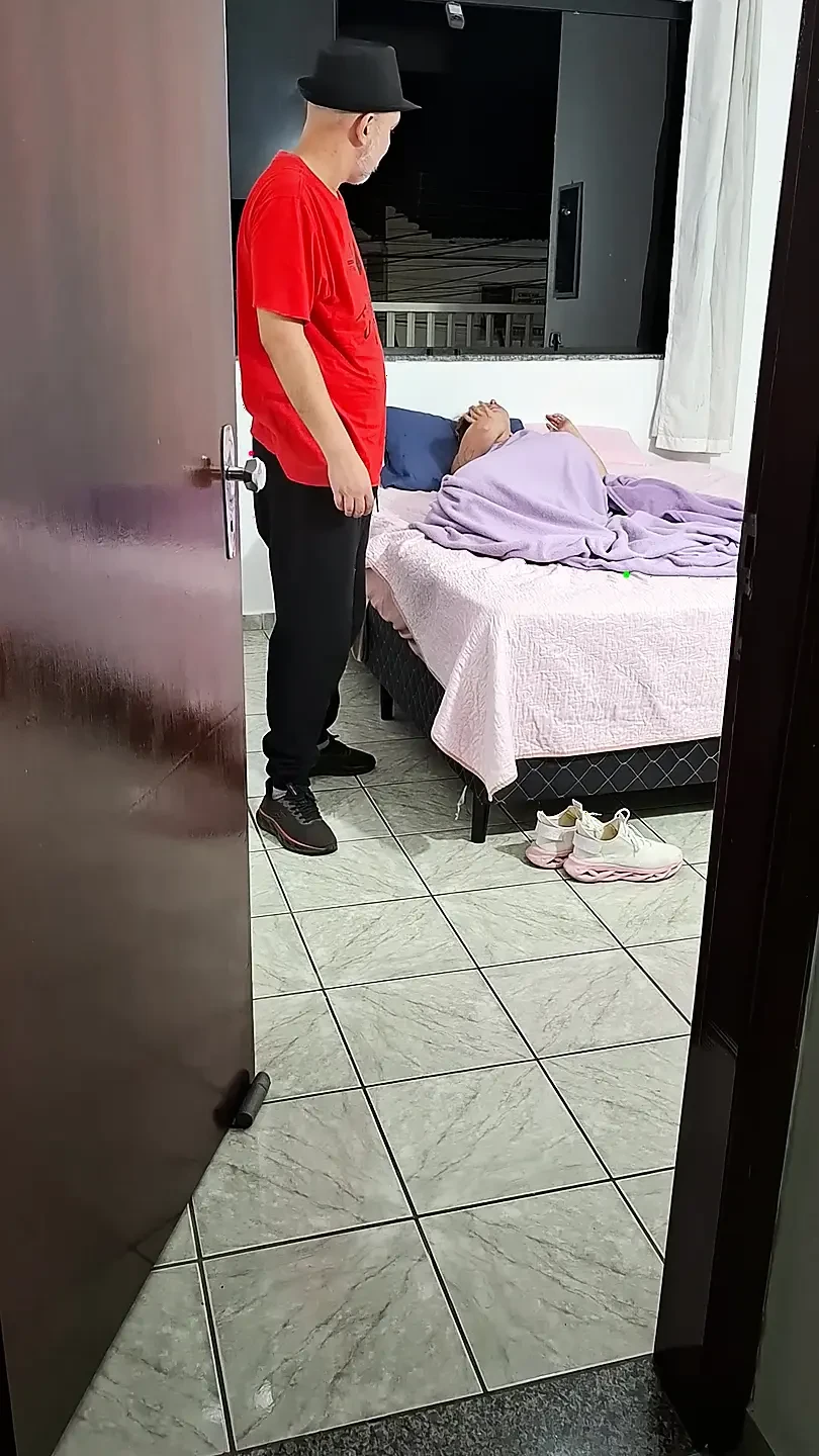 Stepfather helps stepdaughter take off her clothes to go to bed.