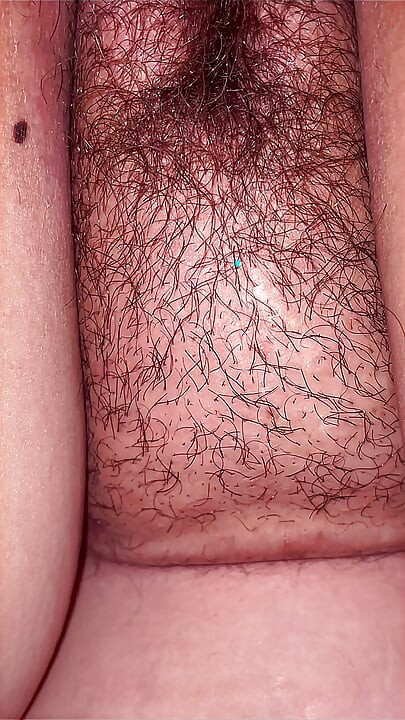 A lustful masseur caught the MILF off guard and licked her all over from behind, exploring her hairy pussy