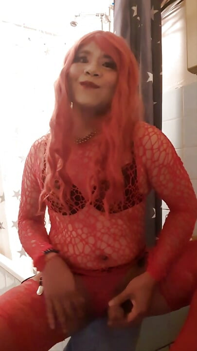 Red Sissy plays with her clit and cum