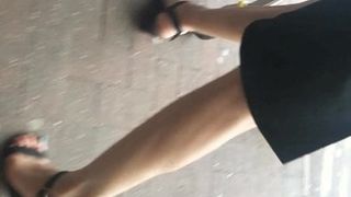 Friends sexy feet in black sandals