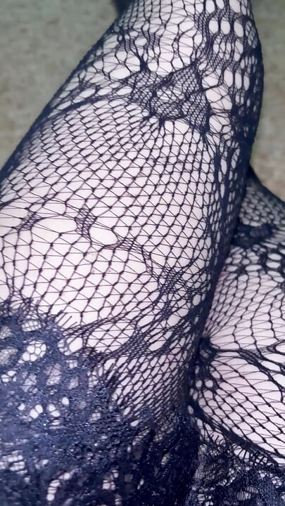 Pernas longas em meias pretas e botas de snd