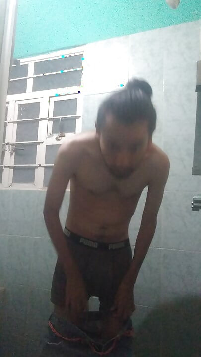Handsome guy takes off his blue sweater and masturbates