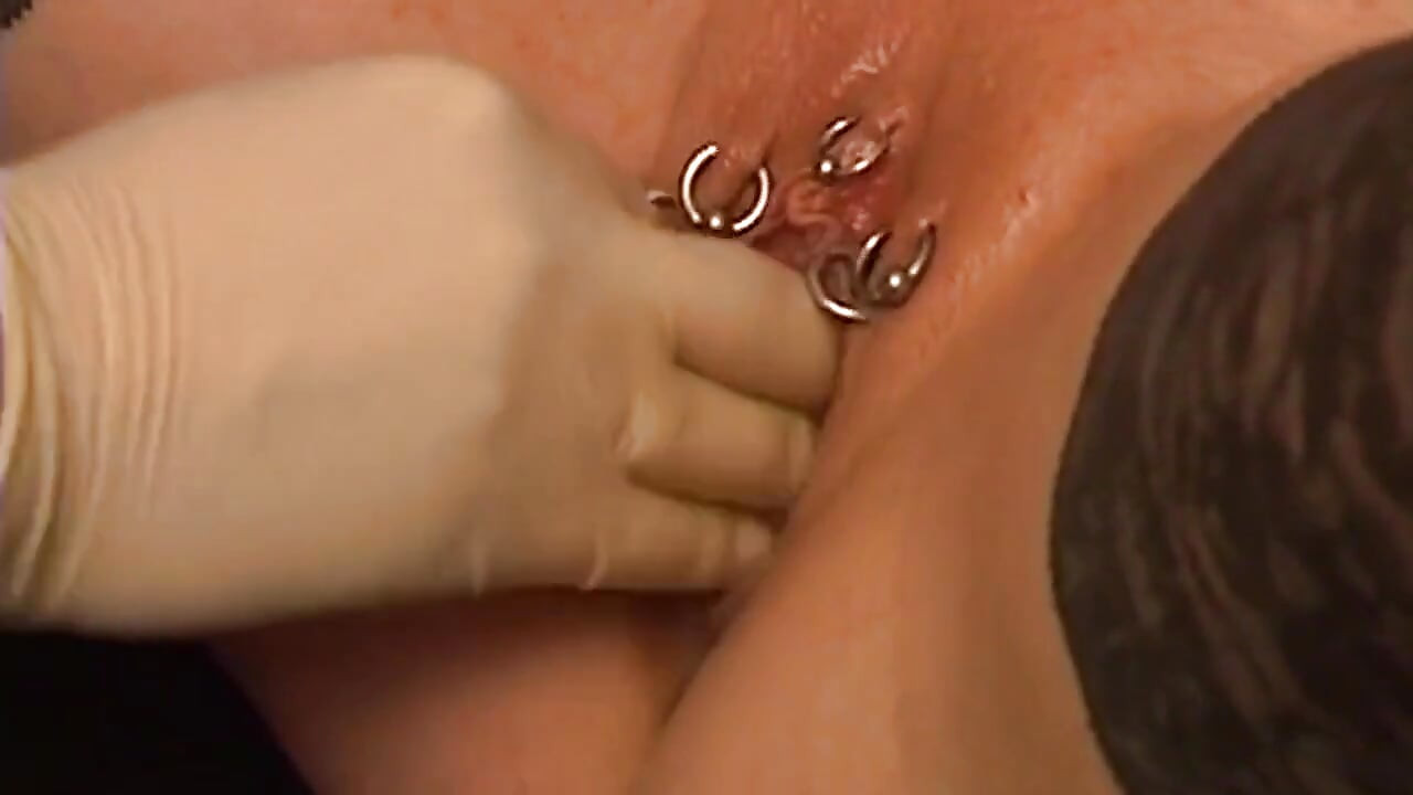 Tattooed Dom Fists Mature Blonde in Chains
