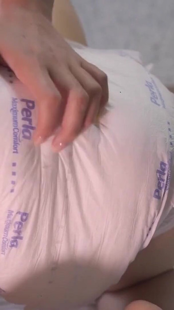 Spectacular moment from "Baby tears up an adult diaper!"