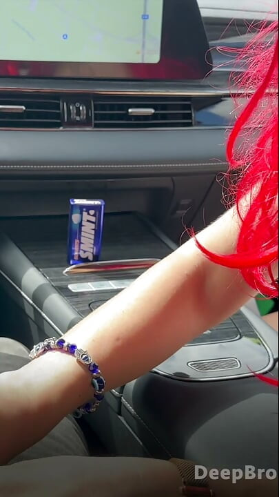 Redhead deepthroats thick BBC in the car, fingers gripping tight