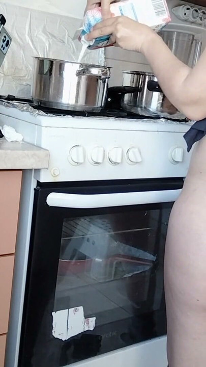 Sexy Latina nude in the kitchen. Sexy naked wife prepares food in the kitchen. | Clip 1