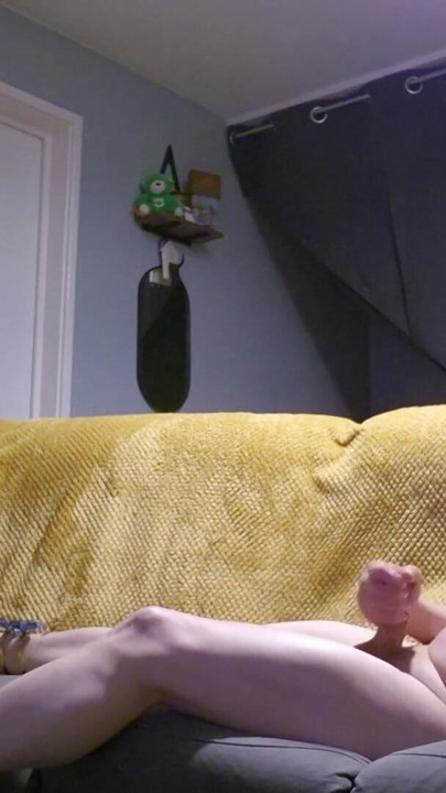 crossdresser layed on sofa playing with her self wearing nothing but her kitten heels and bra | Clip 1