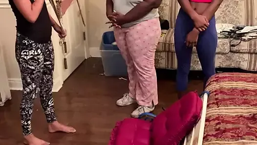 White girl gives two black girls a belt spanking