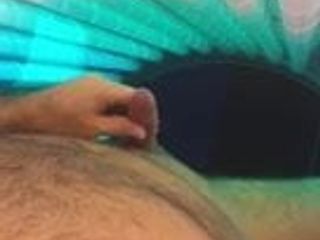 jacking off in tanning bed