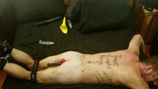 Humliliated faggot slave covered in degrading body writing