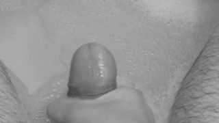 Playing with my cock in the bath.