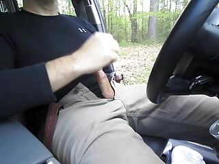 Horny so I pull the car over and jerk-off in a parking lot. I cum, get out and pull up my pants