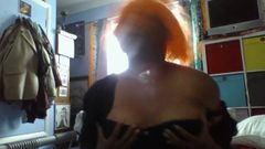 orange wig head shaking breast playing