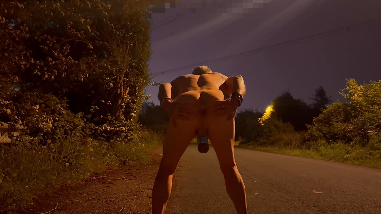 Barefoot nude in road