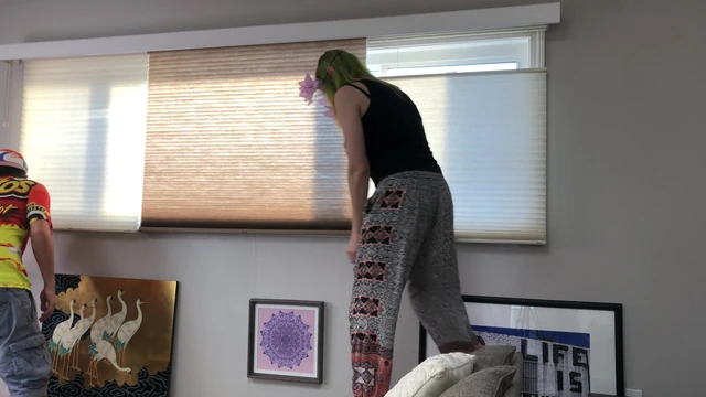 Couple Peeping Outside Apartment Window