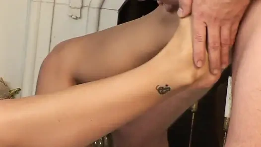 Lovely hottie working his cock with her feet