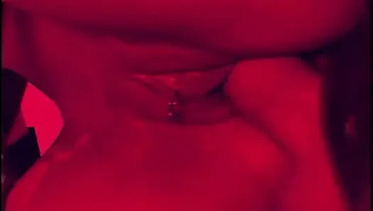 Two guys wearing masks get their large cocks sucked by a hot chick in latex gear