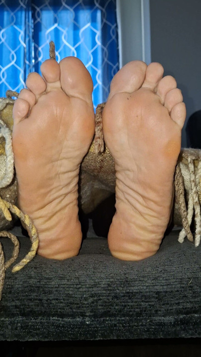 Removing the covers to reveal her cute, tired feet