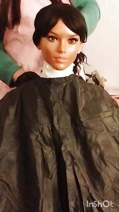 Ebony sex doll Nikki wears barberette capes