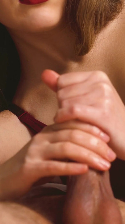 Unforgettable moment from "A beauty in sexy lingerie and red lips jerks off her boyfriend and brings him to orgasm."