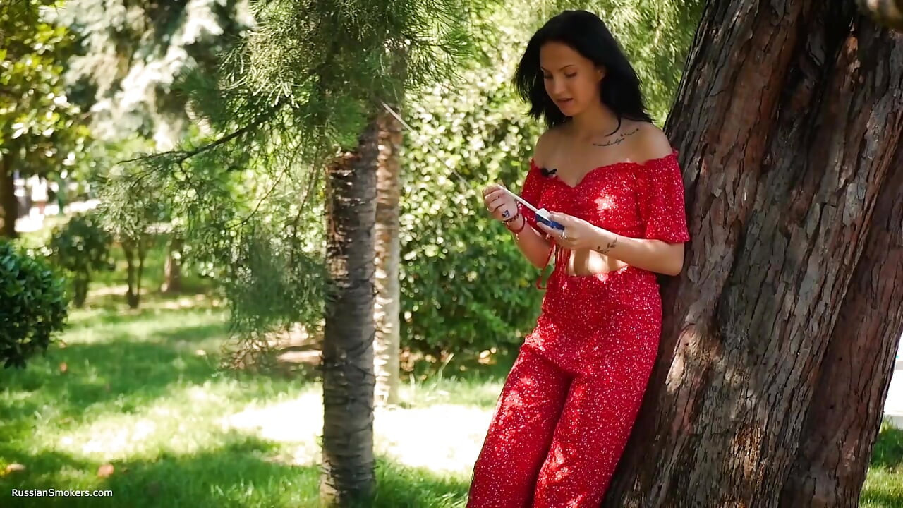 Seductive Russian Beauty Smoking Slim Cigarette Outdoors