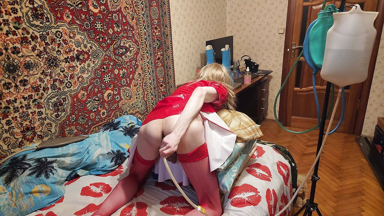 Sissy in fetish red pvc dress water enema bag self punishment