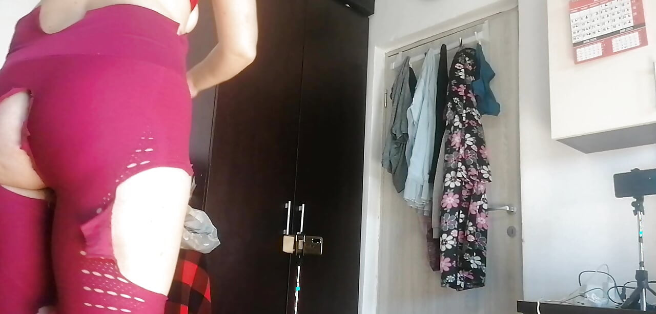 Sexy Latina Having Fun Trying on Clothes and Cutting Them