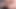 Beautiful woman masturbates in front of the camera, putting things in both sides