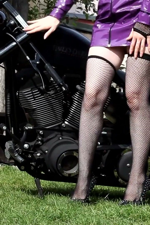 Hot MILF with big boobs on the bike