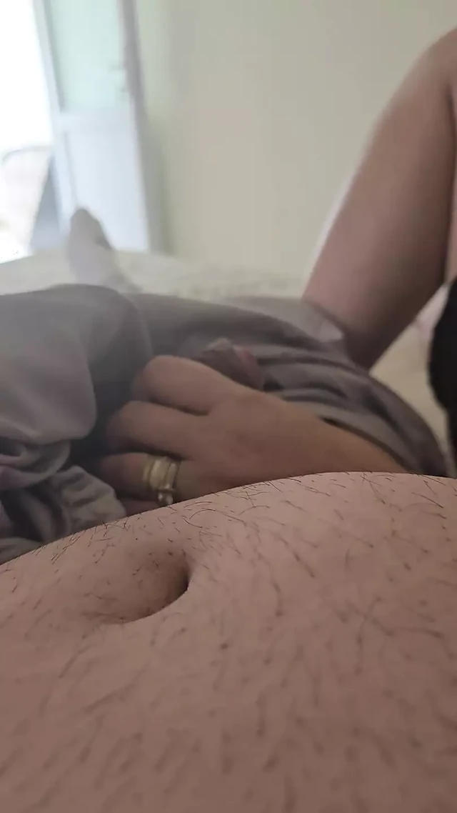 Step mom pulled out step son dick under blanket and handjob him