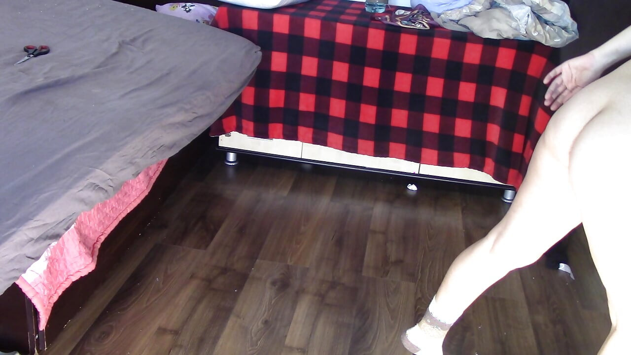 Amateur wife dancing and trying on clothes she cuts. Amateur wife vacuuming in bedroom.