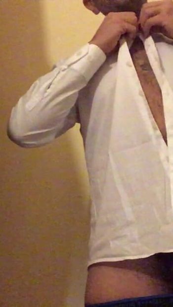 Italian waiter undresses in hotel dressing room