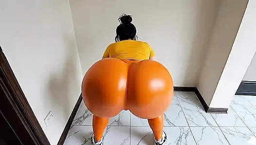 big-bootied woman in orange leggings moving