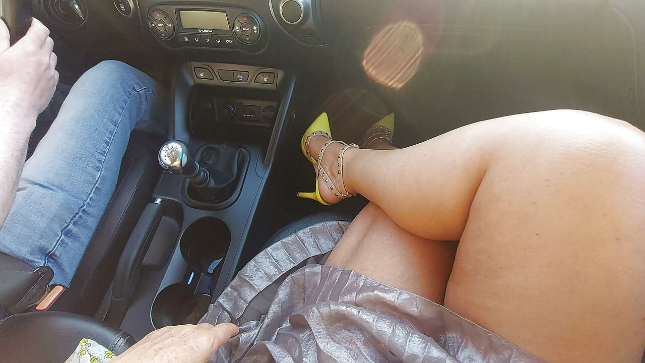 An elegant mature lady with beautiful legs in high heels seduces a taxi driver in the morning