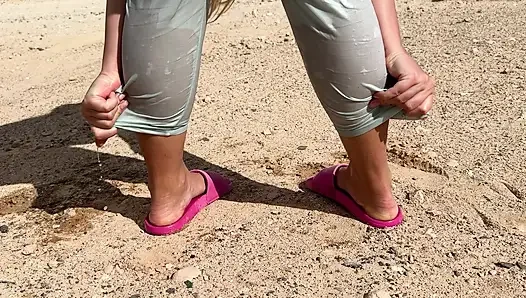 Girl can't hold pee and wet her pants on the public road