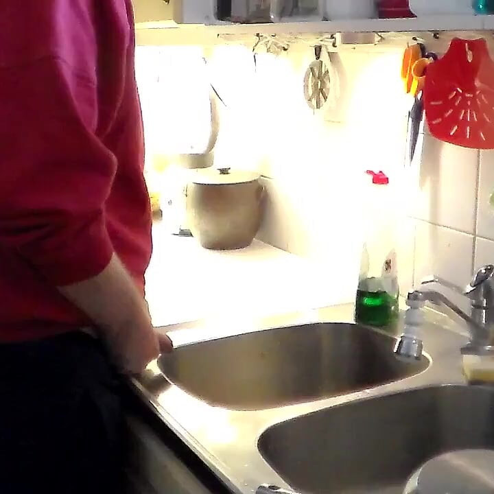 John Is Pissing in the Kitchen Sink