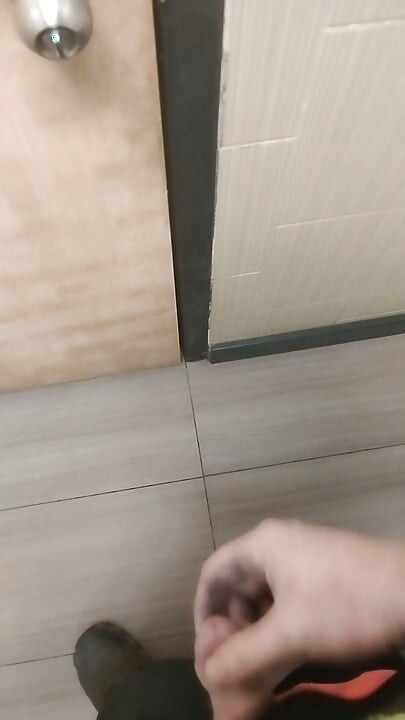 Jerking and cumming in public bathroom hallway