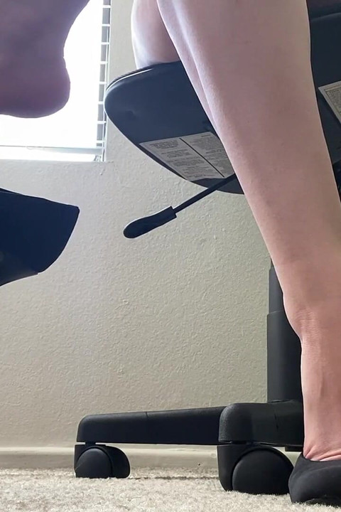 Secretary Dangles Black Heels at Desk