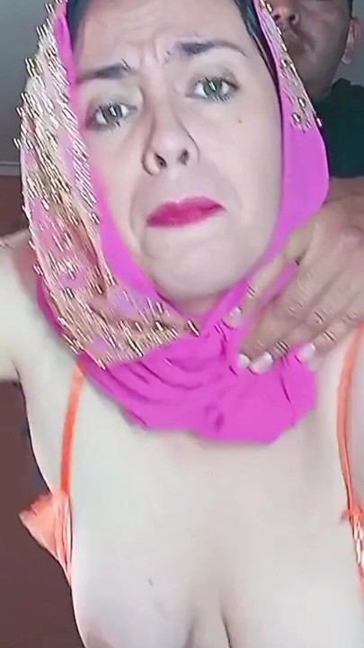 The Indian woman wearing a hijab allows herself to be dominated in the kitchen. | Clip 1