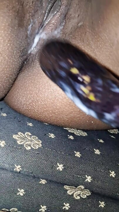 Desi girl masturbates with eggplant and moans loudly